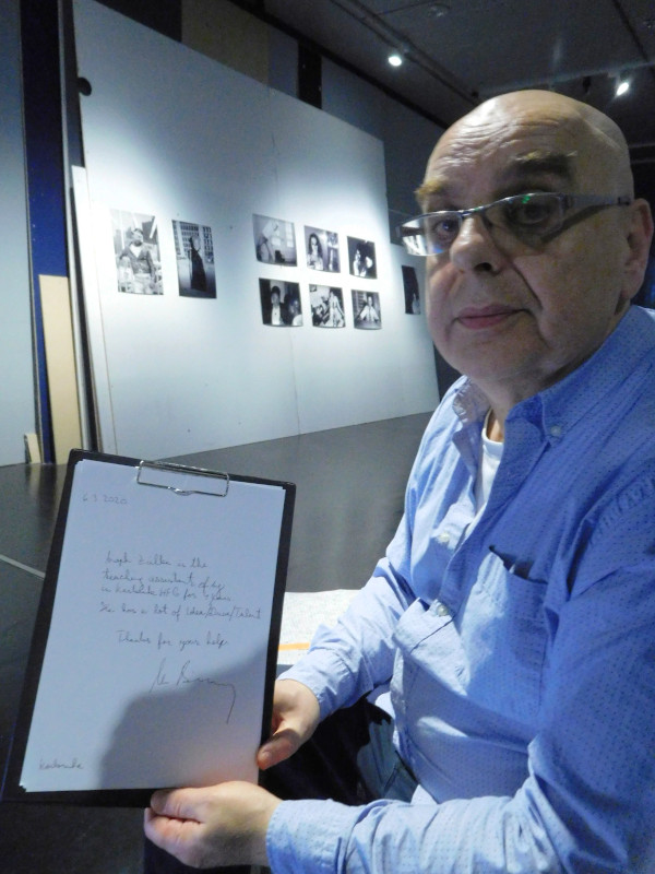 Michael Bielicky holding the recommendation letter he just wrote.